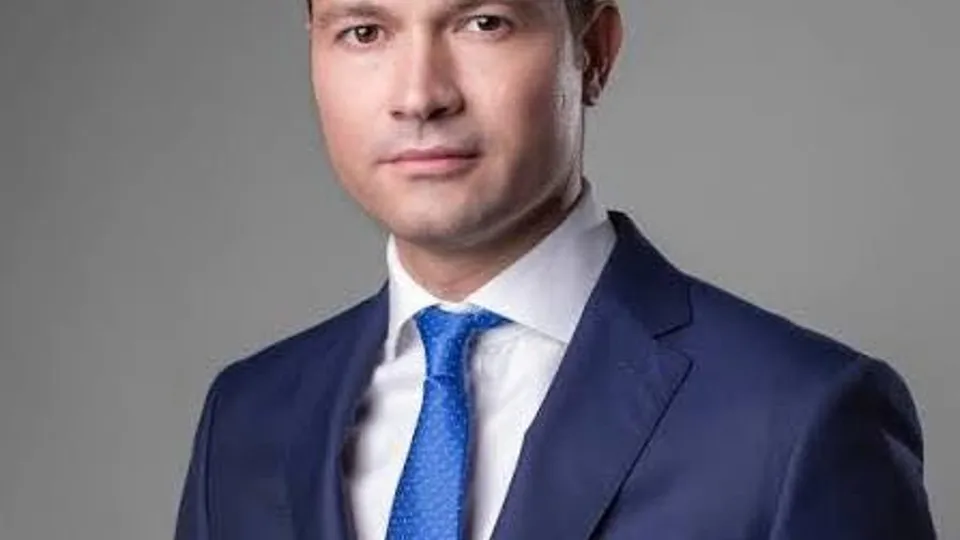 May be an image of one or more people and suit